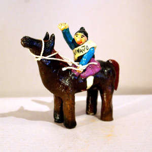 Navajo folk art: Miss Navajo Nation on horseback