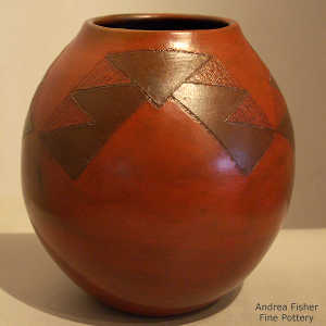 Navajo rug design on a brown jar