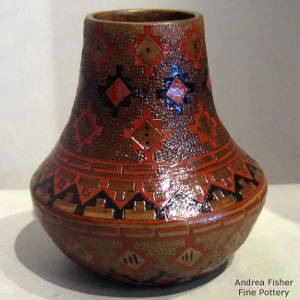 A Navajo rug design and pine pitch coating on a tall neck brown jar