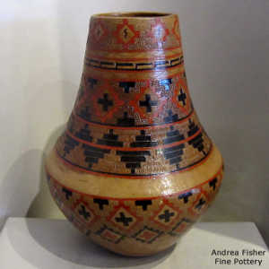 Navajo rug design on a brown jar