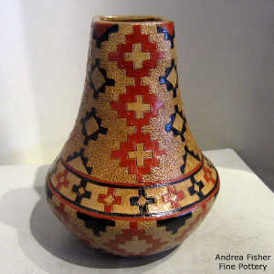 Navajo rug design on a tall neck brown jar