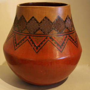 Navajo rug design on a brown jar