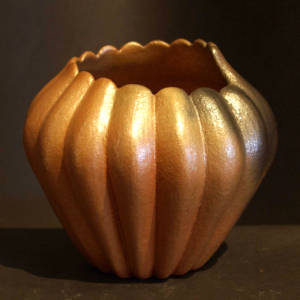 Organic opening on a golden micaceous melon jar