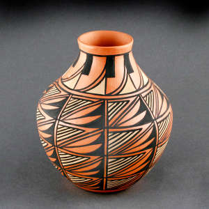 Bird elements and a geometric design on a polychrome jar