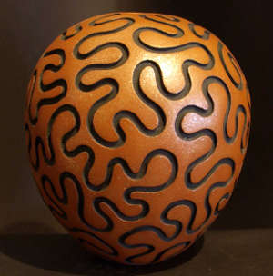 A deeply grooved pot by Hubert Candelario