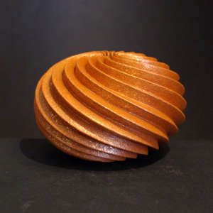 Deep carved spiral orange micaceous seed pot
