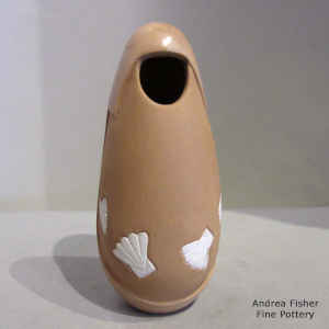 Lightly carved brown jar with sgraffito and painted fans