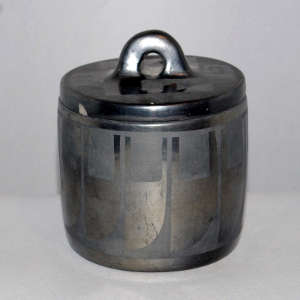 Geometric design on a lidded gunmetal jar