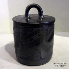 Geometric design on a lidded black-on-black jar
