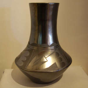 Geometric design on a black on black tall neck jar