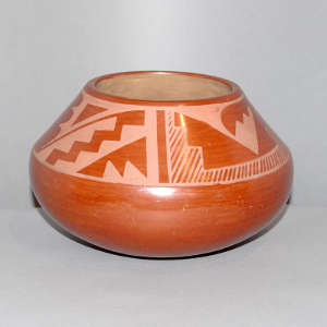 Kiva step and geometric design on a white on sienna jar