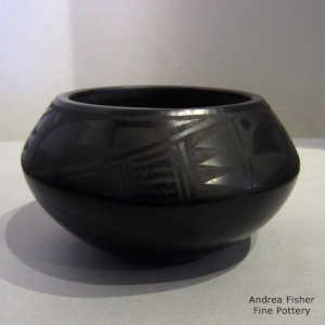 A geometric design on a black-on-black bowl