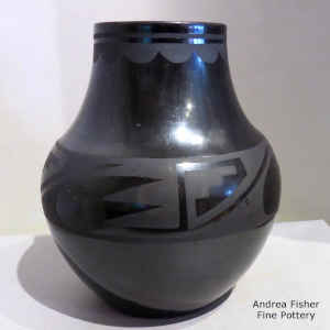 4-panel geometric design on a black on black jar