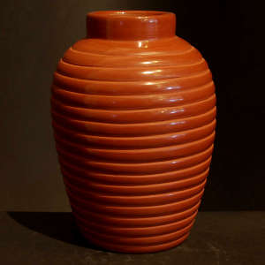 Coiled ribs on a polished red jar