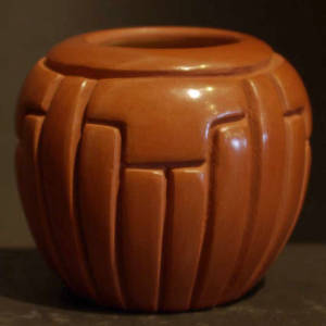 Ribs and kiva step design carved into a red jar
