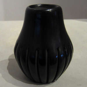 Carved black melon jar