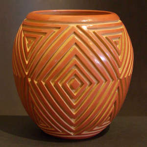 Geometric designs carved into a red jar