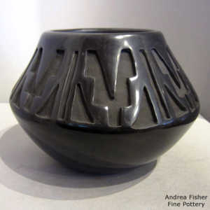 Kiva step and geometric design carved into a black jar