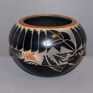 Click for a larger version Sgraffito avanyu, butterfly and geometric design on a black jar with a sienna rim