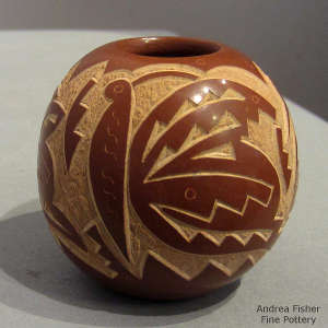 Sgraffito butterfly and geometric design on a red seedpot