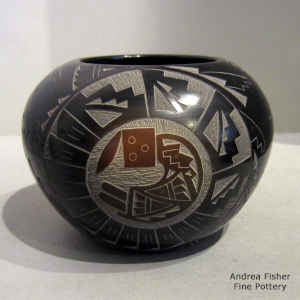 A sgraffito medallion, yei and geometric design on a red jar