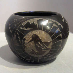 Sgraffito rabbit, hummingbird and Yei medallions with geometric design on a polished black jar with sienna spots