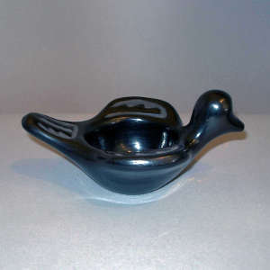 Geometric design carved into a black bird bowl