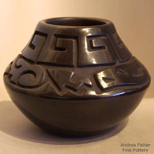 Avanyu design carved into a black jar