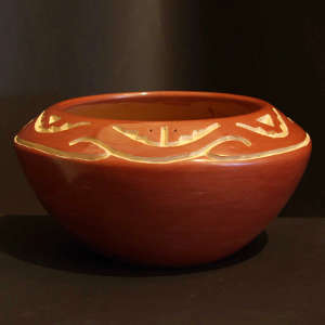 Geometric design carved into a red bowl