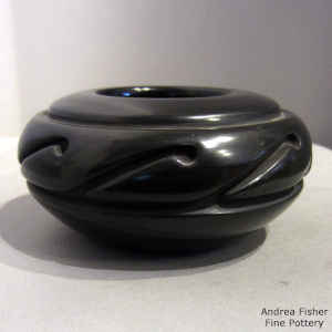 Geometric design carved into a black bowl