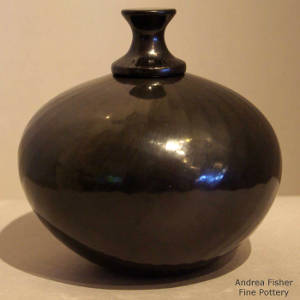 Lidded faceted black jar