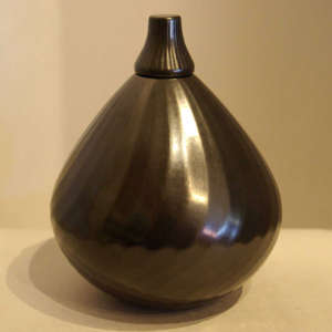 Black jar lidded and faceted