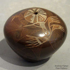 Sgraffito dragonfly, hummingbird and geometric design on a sienna seed pot