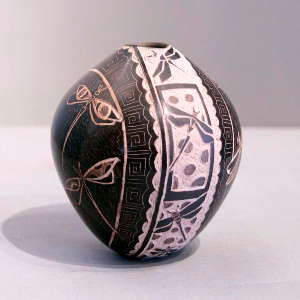 Sgraffito dragonfly and geometric design on a black seed pot