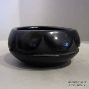 Geometric design carved into a black bowl