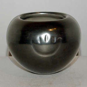 Bear paw imprint on a plain black jar