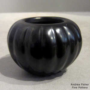Carved black melon jar