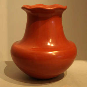 Fluted rim on a polished red jar