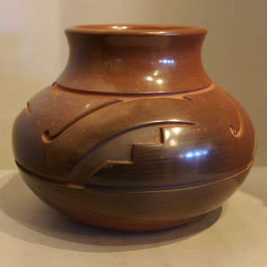 Geometric designs carved on a burnished jar