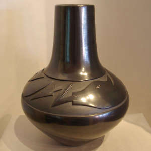 Avanyu design carved into a black jar