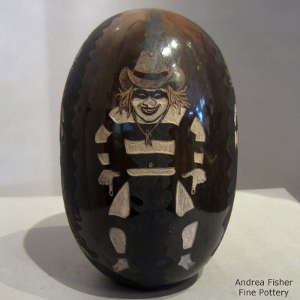 Four direction sgraffito koshare design on a polished dark brown jar