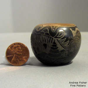 Sgraffito avanyu, bear paw, nature and geometric design on a miniature black jar with a sienna rim