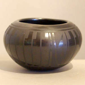 Feather design on a black on black jar