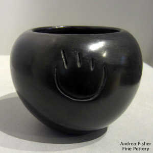 Bear paws carved into a black bowl