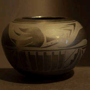 Avanyu, feather and geometric design on a black on black jar