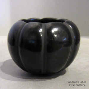 Carved black melon jar