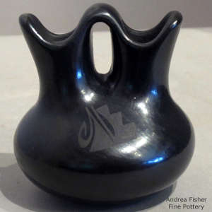 Geometric design on a black on black wedding vase