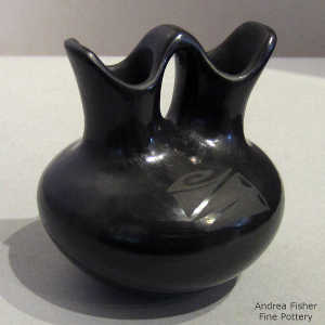 Geometric design on a black on black wedding vase