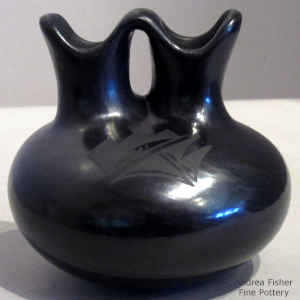 Geometric design on a black on black wedding vase