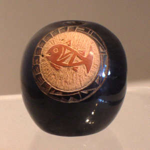 Sgraffito fish medallion and sienna spot on a black seed pot